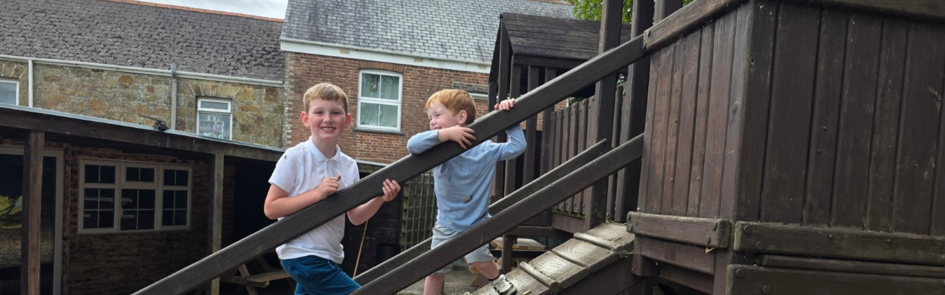 Children enjoying the outdoor play area at The Quintrell Inn, a family-friendly pub near Newquay, Cornwall